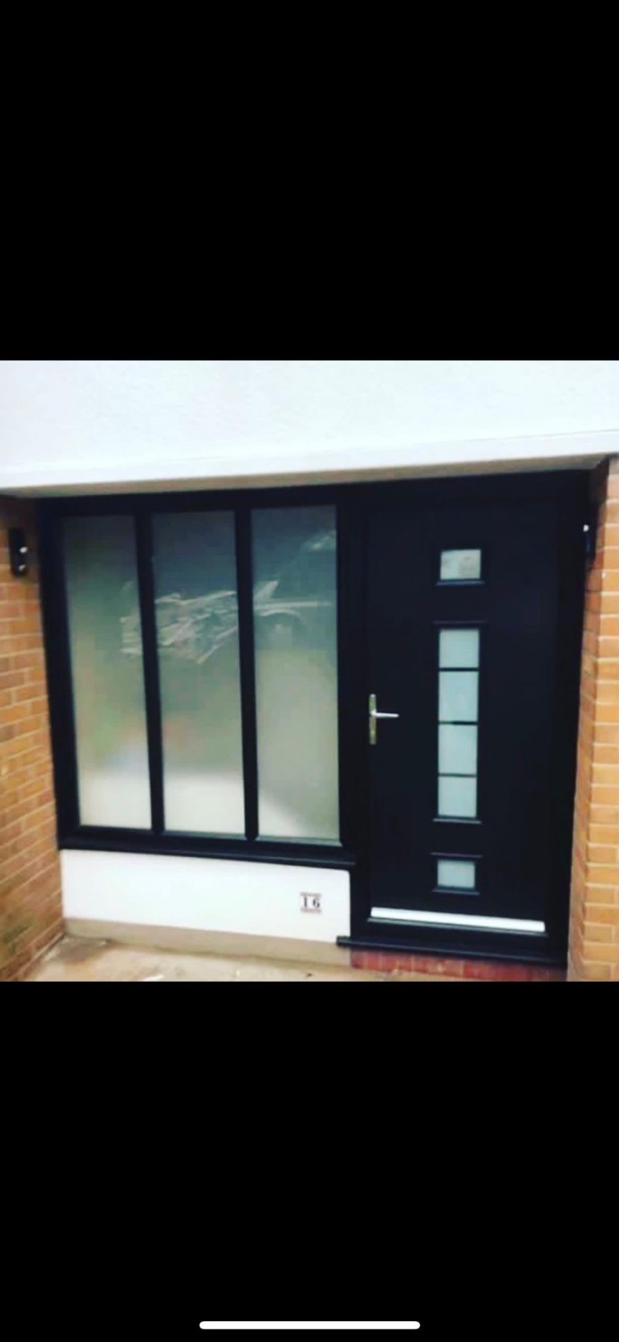 Black composite door with full-height glazed side panel